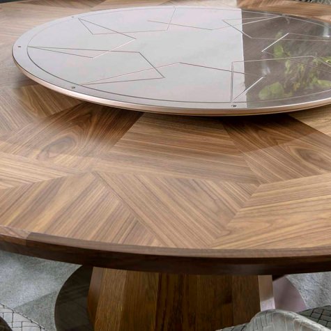 Round table in solid walnut with inlay