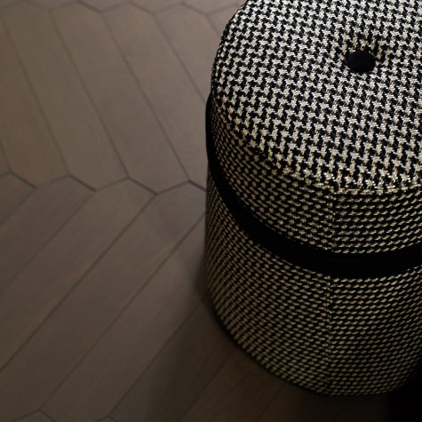 Upholstered pouf with circular base