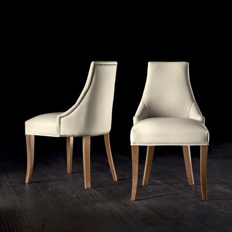 Upholstered chair in solid walnut or oak Upholstered chair in solid walnut or oak