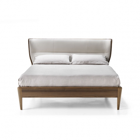 Upholstered bed in solid walnut